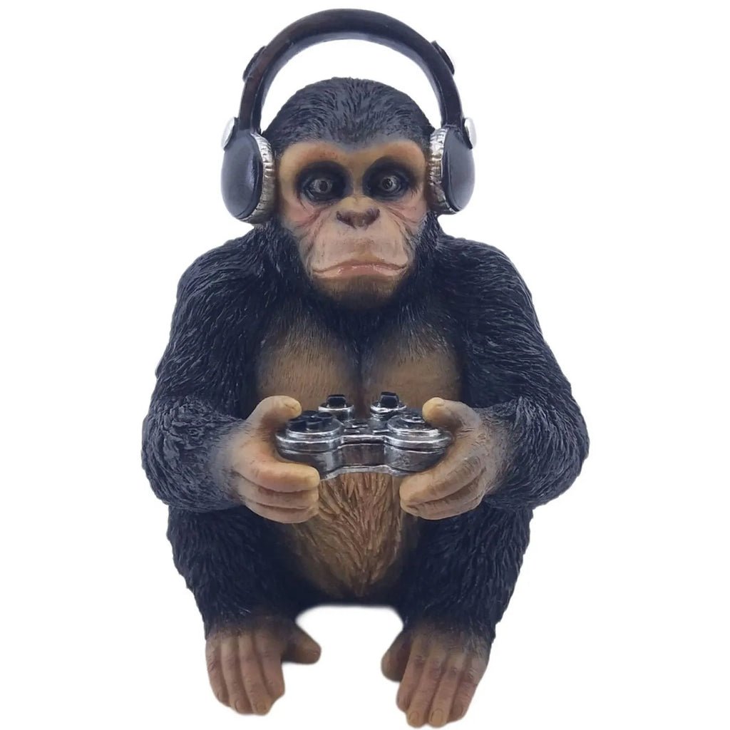 Statue of a monkey wearing headphones and holding gaming controllers on a white background-Mystic-Cave