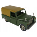 Model of a green Land Rover with a brown roof on a white background