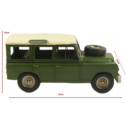 Green model car with dimensions indicated on a white background-Mystic-Cave