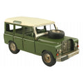 Model of a green vintage SUV with a spare tire on a white background-Mystic-Cave