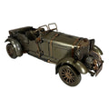 Metallic model of an old-fashioned car on a white background-Mystic-Cave