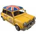 Yellow model car with British flag on roof against a white background-Mystic-Cave