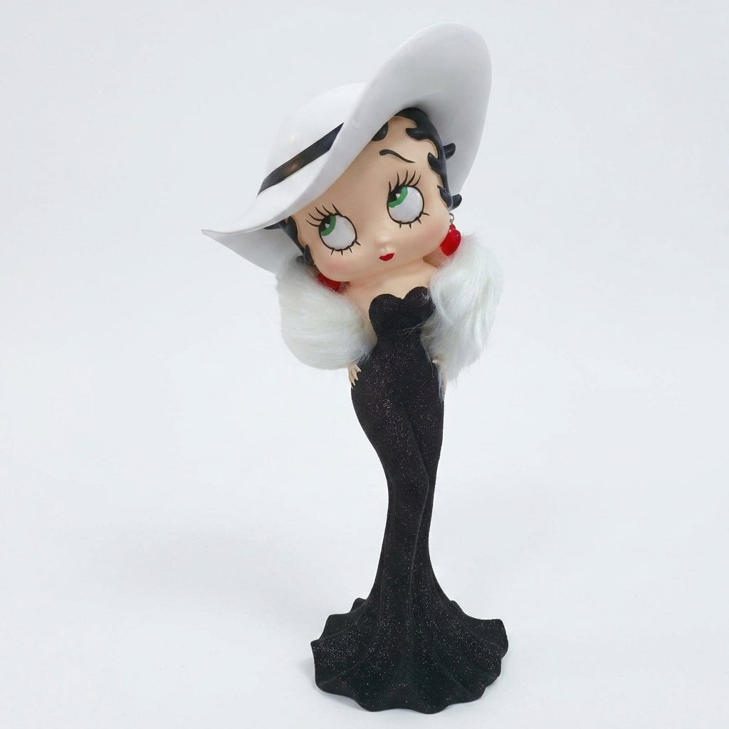 A collectible figurine of classic cartoon character Betty Boop wearing a black glittery gown, white faux fur collar, and a large white hat, set against a plain white background.