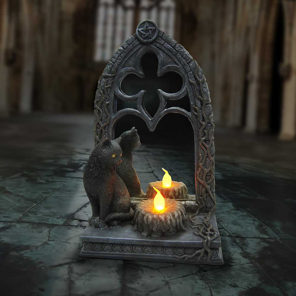 Decorative stone arch with two cats and candles on a stone floor.-Mystic-Cave