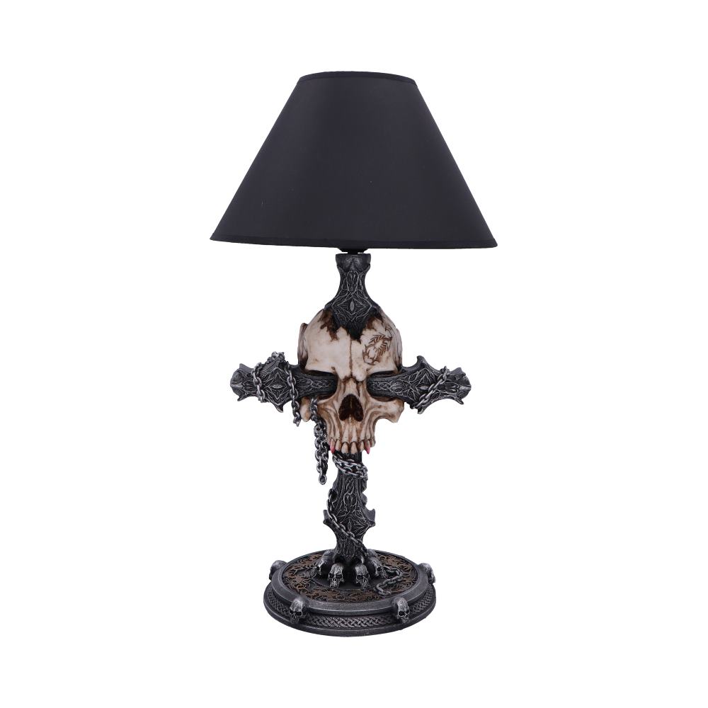Decorative table lamp with skull and cross design on a white background
