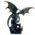 Decorative dragon statue with detailed wings and a castle on a white background