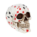 Skull-shaped object with card suit patterns on a white background