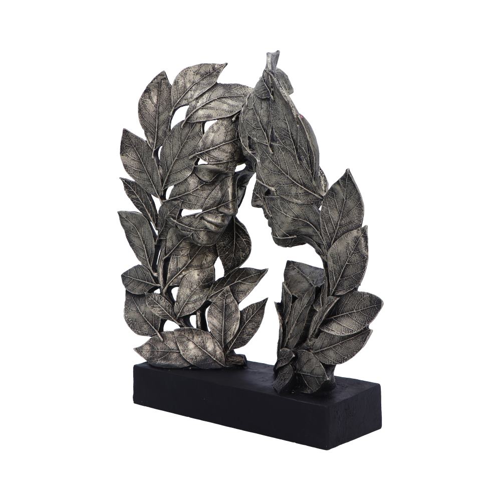 Decorative leaf sculpture on a black base against a white background mystic cave