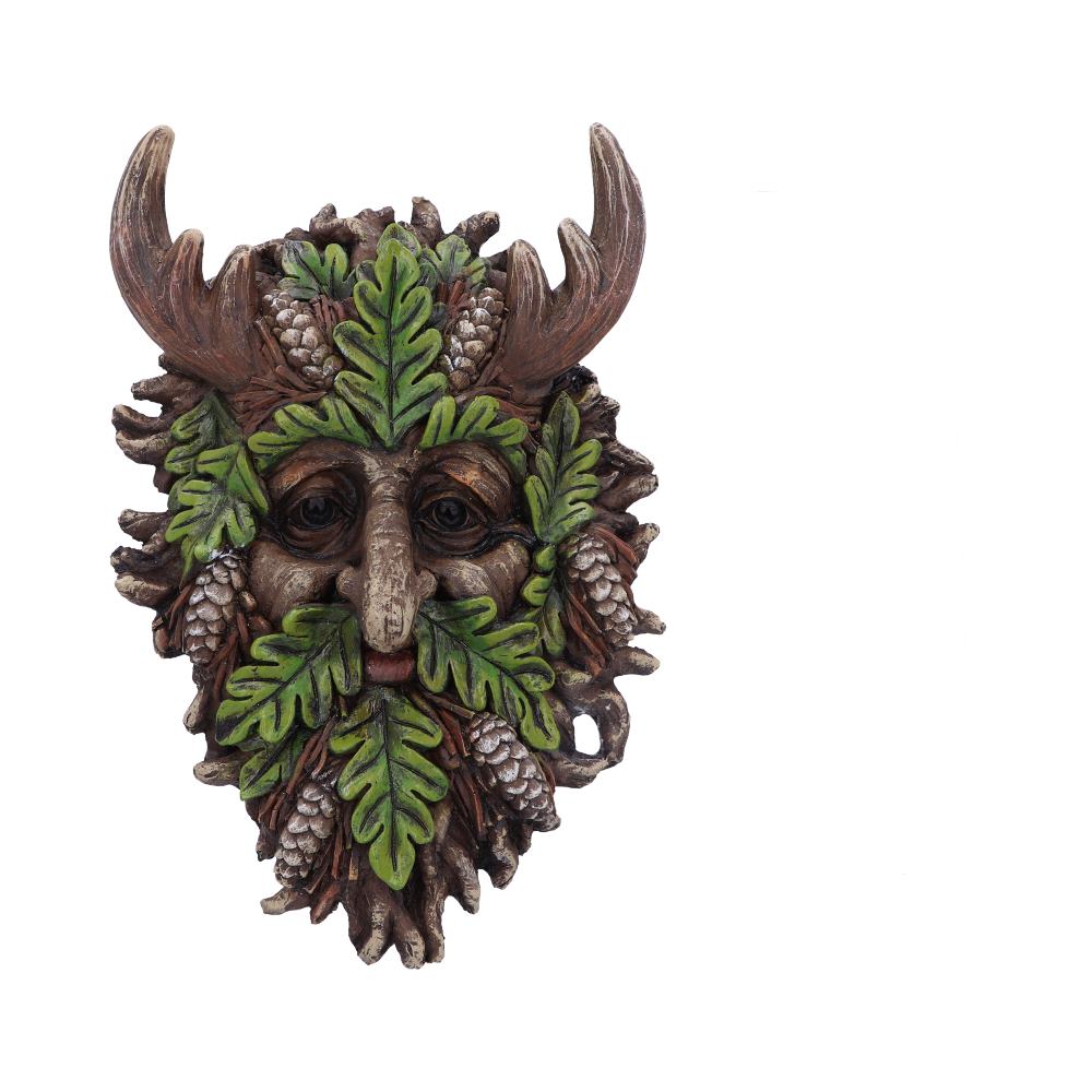 Decorative mask with green leaves, brown antlers, and pinecones on a white background mystic-cave.co.uk
