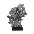 Decorative metal leaf sculpture on a white background mystic-cave