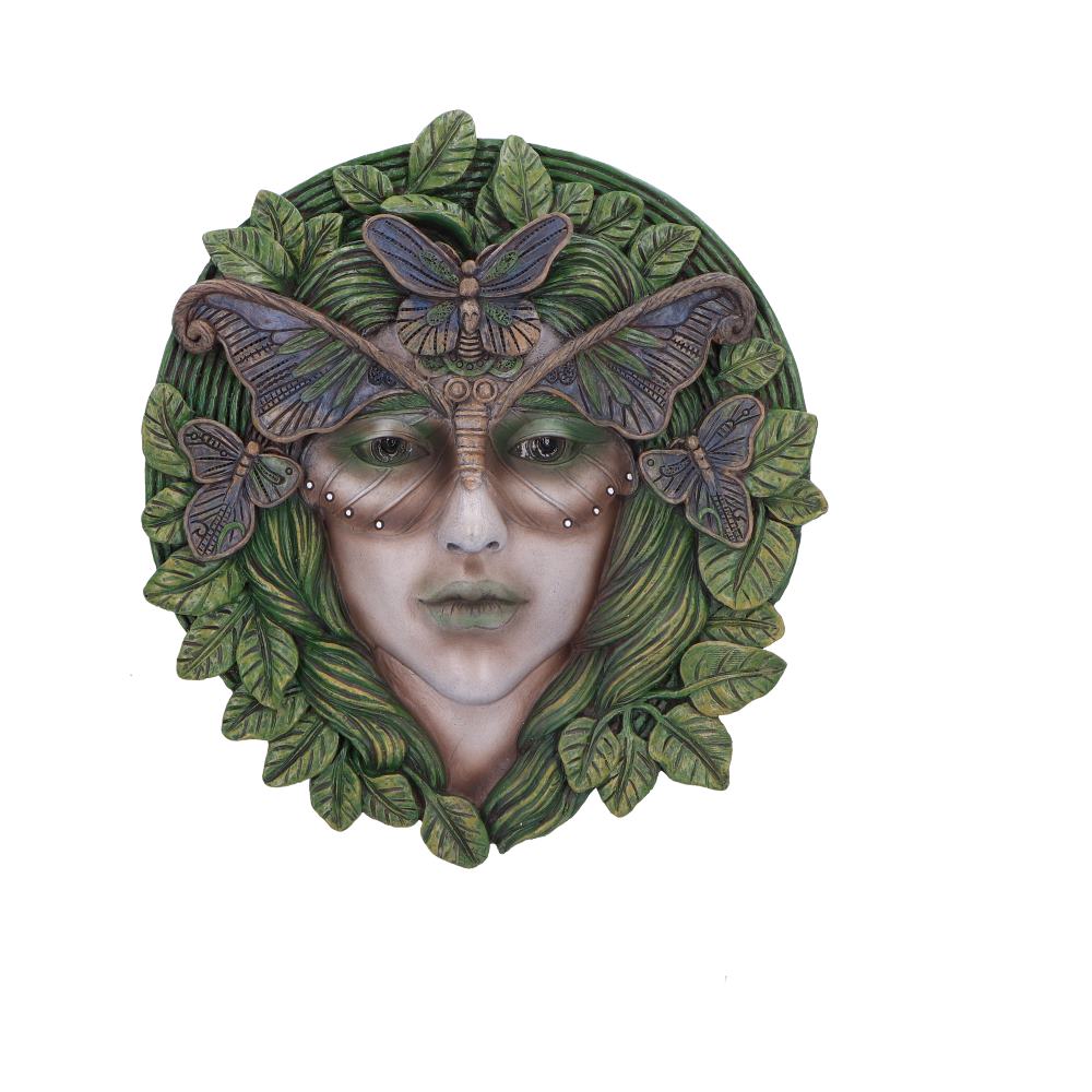 Decorative wall piece with a face surrounded by leaves and butterflies on a white background