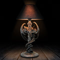 Decorative table lamp with intricate design on a wooden surface-Mystic-Cave