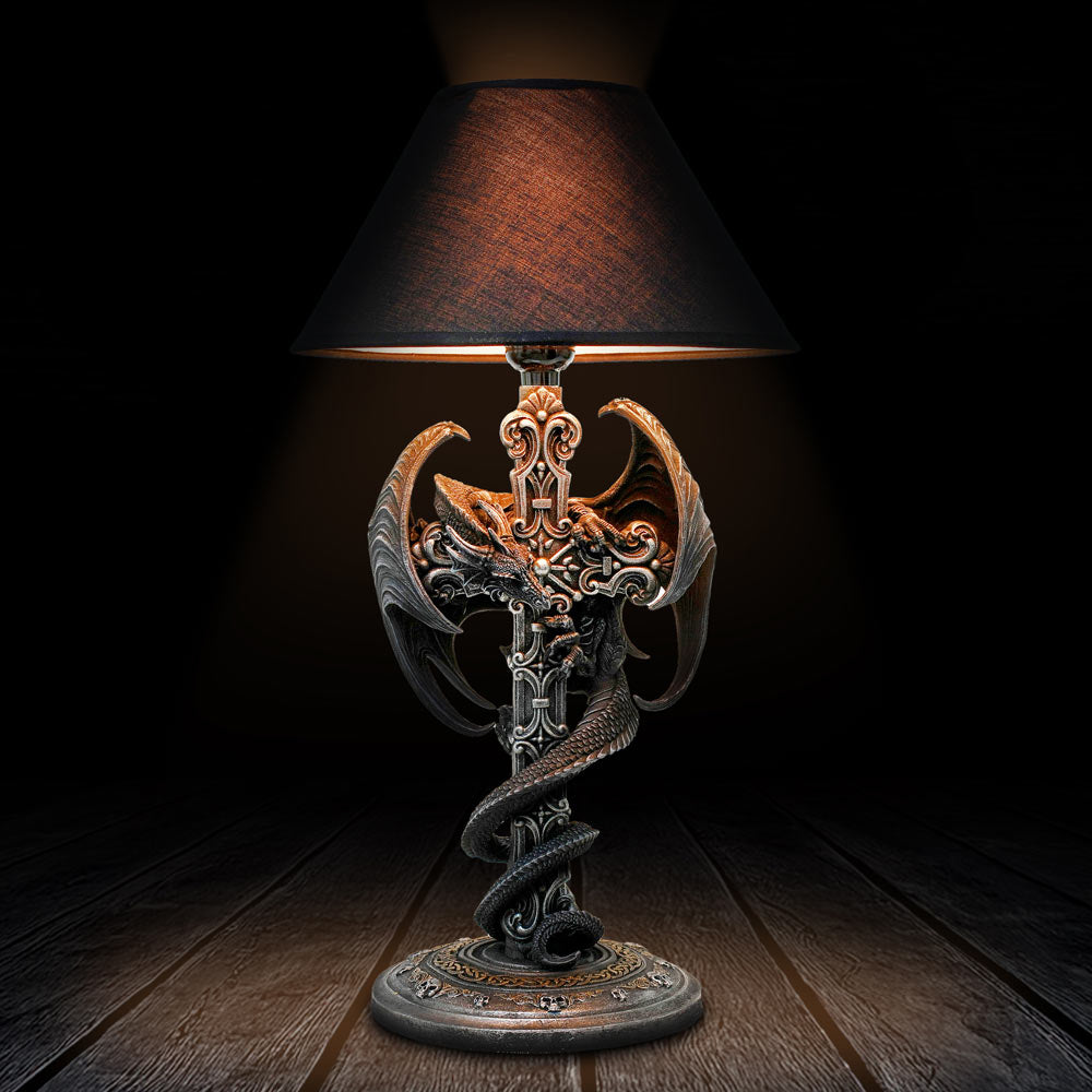 Decorative table lamp with intricate design on a wooden surface-Mystic-Cave