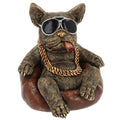 Statue of a bulldog wearing sunglasses and a chain, sitting on a chair.-Mystic-Cave