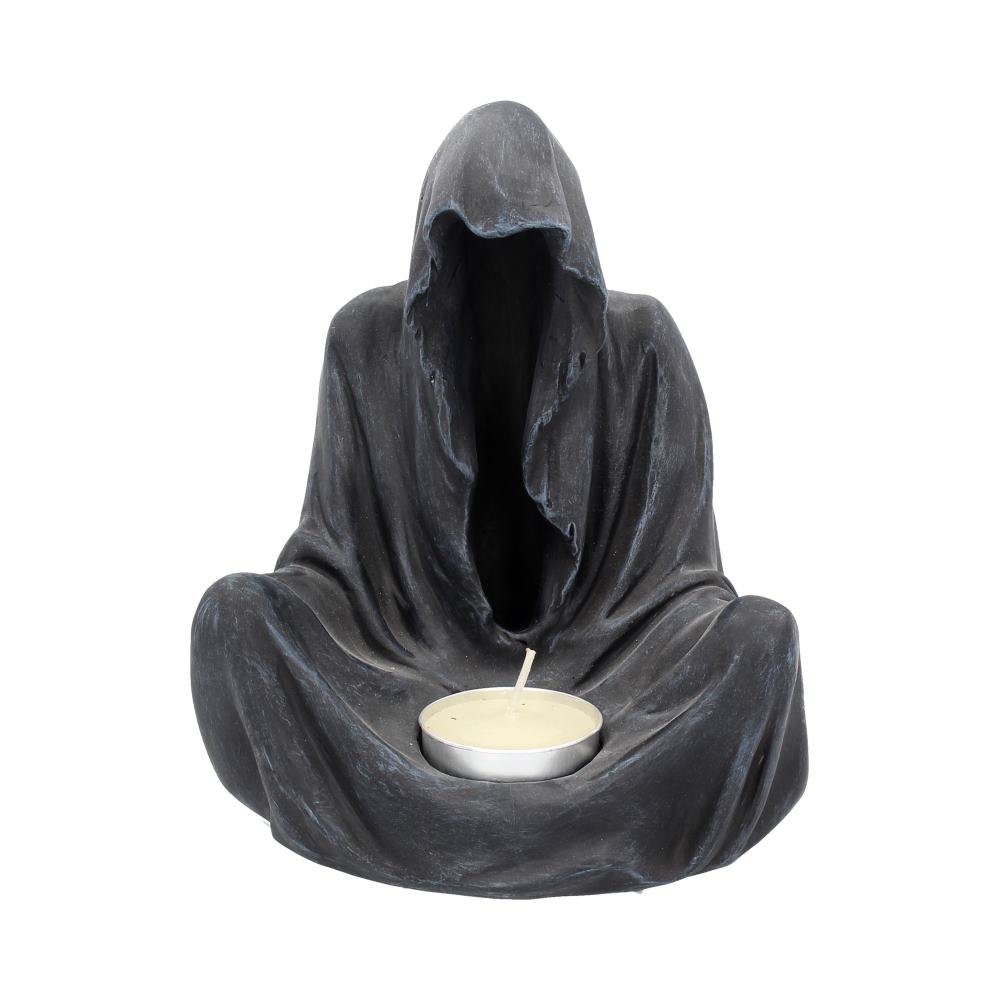 Gloomy figure in a dark hooded cloak holding a candle on a white background