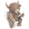 Statue of a Highland cow holding a silver disc on a white background