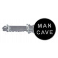 Key-shaped object with 'Man Cave' label on a white background