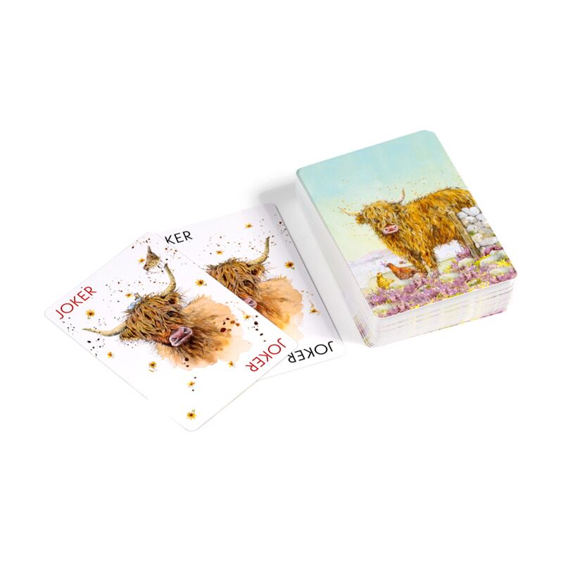 Playing cards with highland cow design on a white background