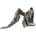 Metallic angel figurine on a white background-Mystic-Cave