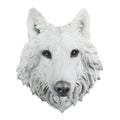 White wolf head sculpture on a white background