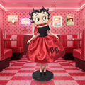 Betty Boop in 50s costume figurine with glamorous vintage pink retro diner background and neon lighting