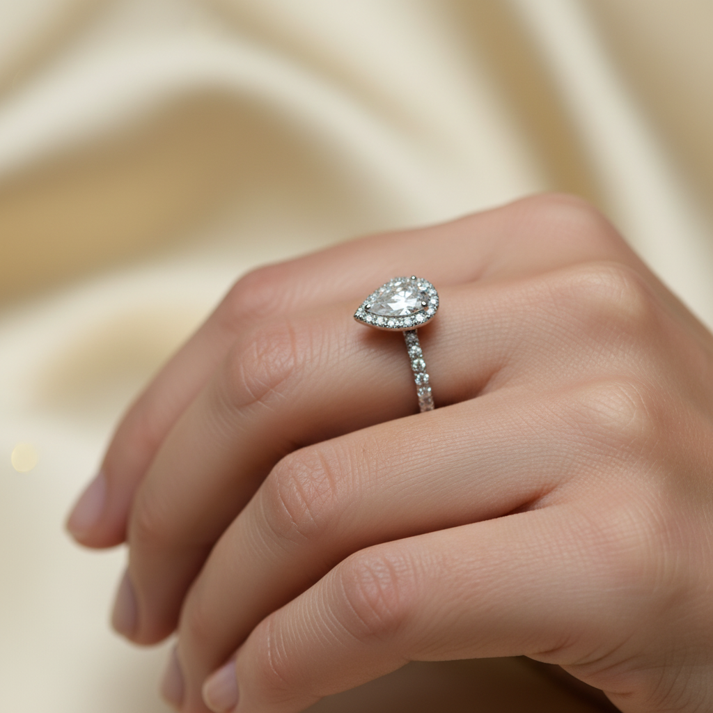 Pear Cut Diamond Halo Ring on lady's hand
